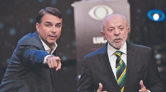 Flávio Bolsonaro abre vantagem na pesquisa Real Time Big Data, com 52% contra 48% de Lula